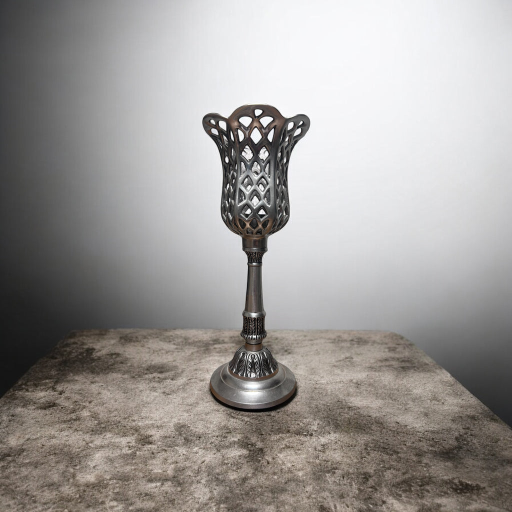 14.5 inch tall metal tea light candle holder. Silver tone.